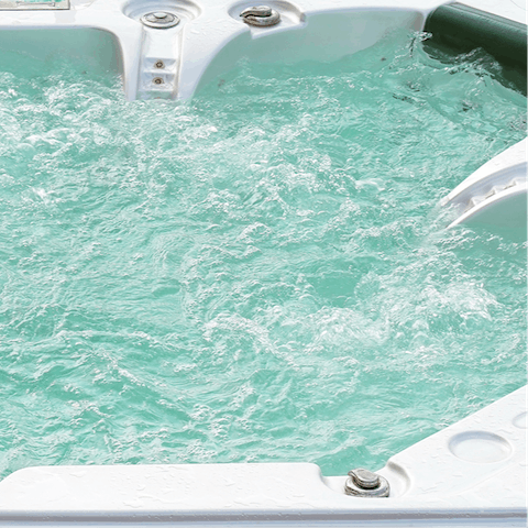 Jump in one of the hot tubs and switch on the bubbles