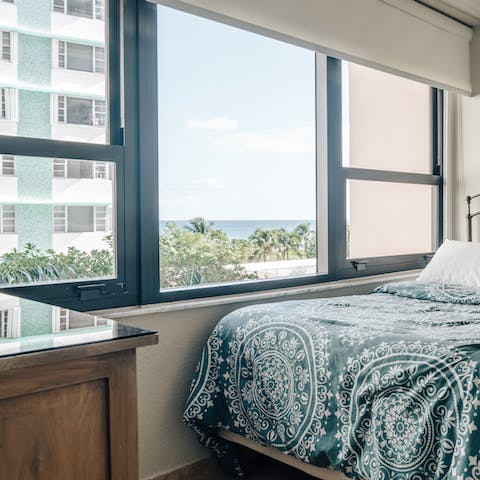 Wake up to views of green swaying palms and the turquoise sea