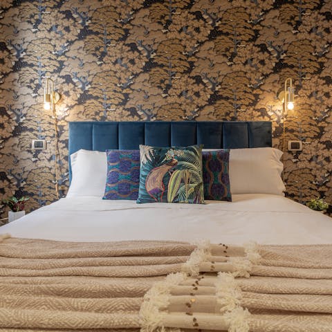 Curl up in the sumptuous bedroom after a long day on your feet