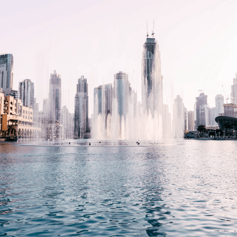Watch the enthralling Dubai Fountain, a ten-minute car ride from your building