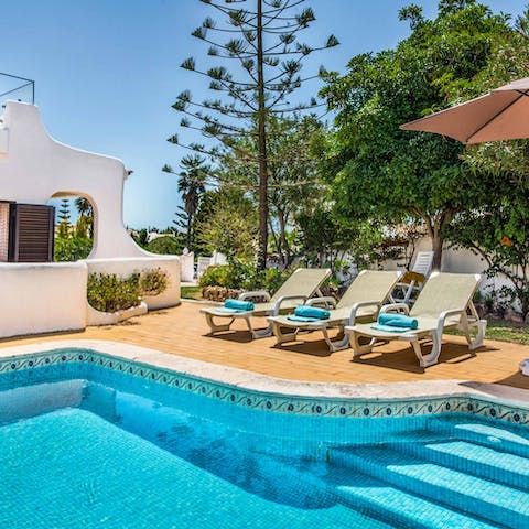 Soak up the sun on the comfy loungers and take a refreshing swim in the glistening pool 
