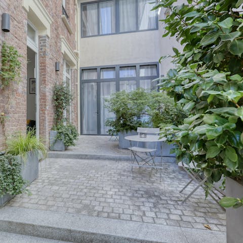 Tuck into a coffee and croissant in the shared courtyard