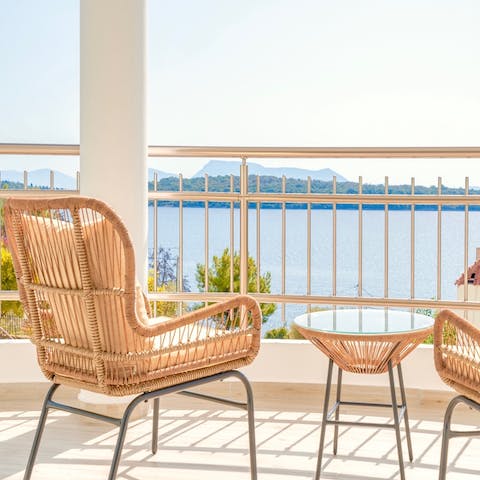Gaze out at stunning views of the sea and Skorpios Island from your private balcony