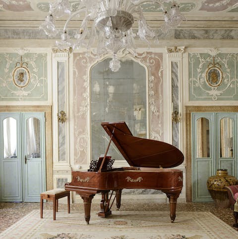 Serenade your guests in the grand living room