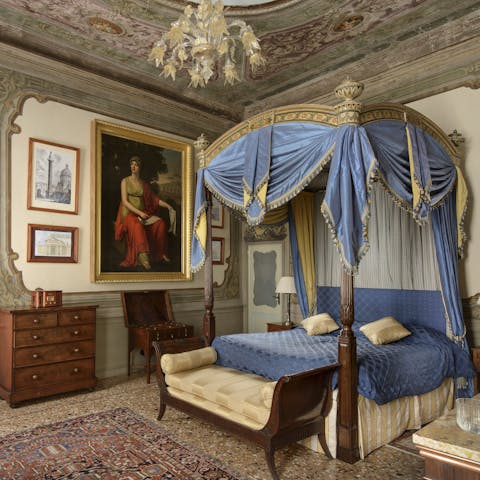 Sink into the opulent four poster bed and drift off to sleep