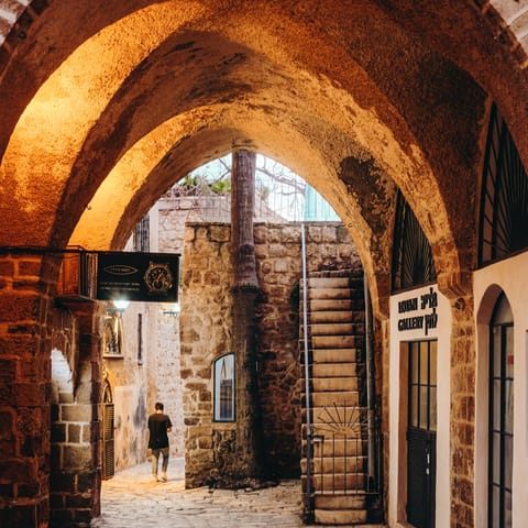 Discover the winding alleys of Old Jaffa, a twenty-minute ride away