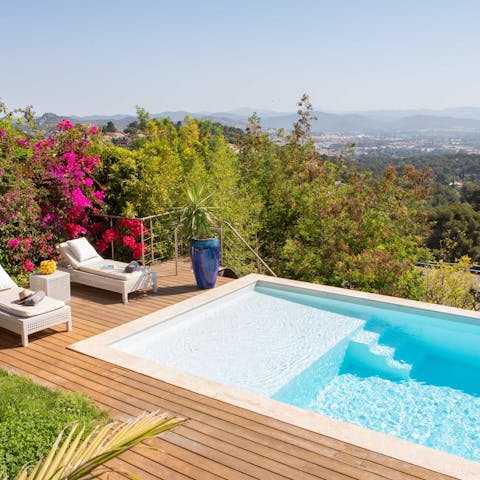 Admire the far-reaching views from the sparkling infinity pool