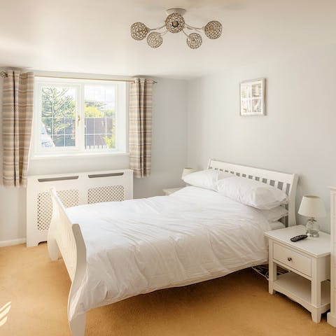 Wake up feeling refreshed and relaxed in the bright bedroom