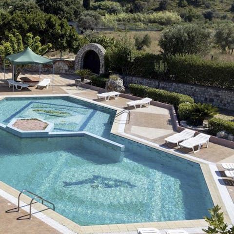 Relax by the uniquely-shaped, private pool and cool off from the sun