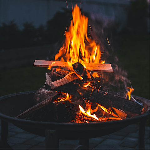 Gather around the fire pit after a long day on the nearby golf course