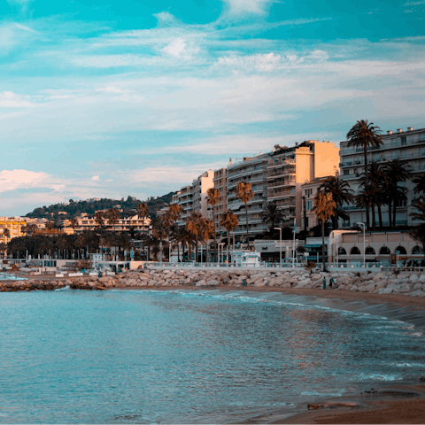 Take a breezy stroll down to the beach of La Croisette and catch some sun