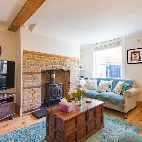 Put a log on the wood burning stove and spend cosy nights curled up by the fire
