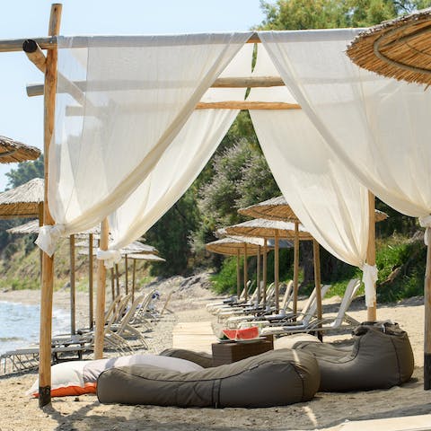 Take advantage of your private beach section with reserved sun loungers and parasols