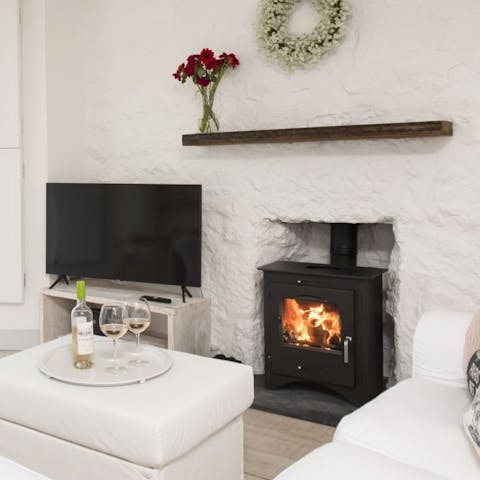 Curl up in front of the wood burning stove on cold evenings
