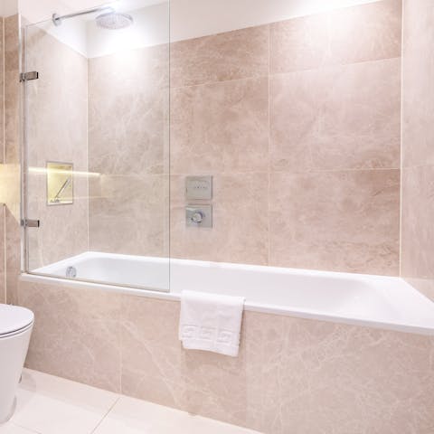 Unwind in the large bath tub after an evening out at the local areas lavish bars and restaurants 