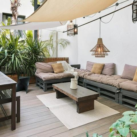 Relax and sip a cocktail on the sprawling outdoor sofa