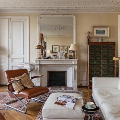 Kick back with some French wine and cheese in the elegant living room after a day of Paris sightseeing