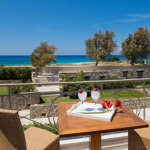Enjoy a drink on the balcony before making the five-minute walk to Agios Ioannis beach