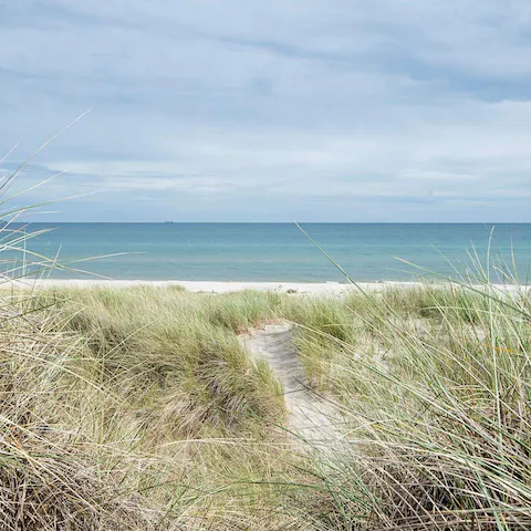 Spend the day at Aalbæk Strand beach, just a six–minute drive away