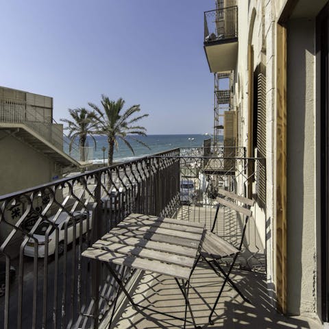 Watch the Mediterranean sunset with a glass of wine on your private balcony