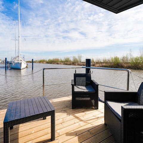 Sunbathe on the terrace with peaceful waterfront views