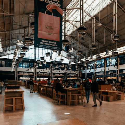 Sample Lisbon's finest cuisine at the Time out Market, a ten-minute walk away