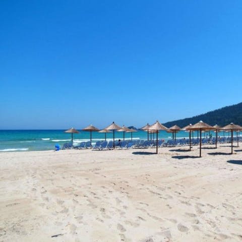 Secure one of the straw umbrellas and spend sunshine days on Metallia Beach, only minutes away