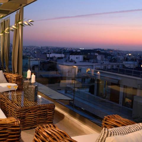 Enjoy the panoramic view of Athens from the balcony