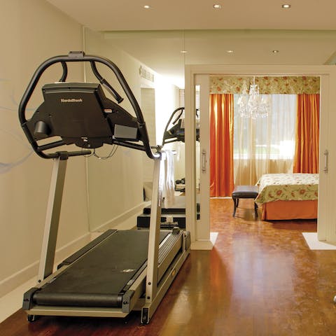 Stay on top of your fitness routine in the gym just off the bedroom