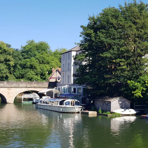 Stroll along the Thames to Christ Church Meadow, opposite the building