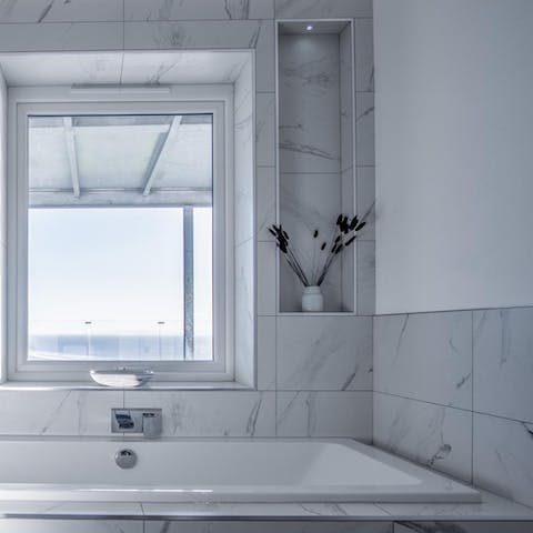Slope away for a soak in the semi-sunken bath and steal a glimpse of the sea