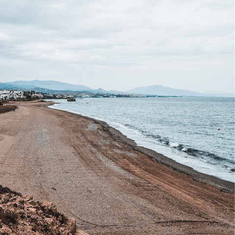 Wander ten minutes to Estepona's sandy beach and dip your toes in the sea
