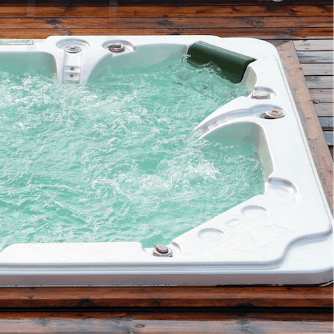 Soak in the outdoor hot tub