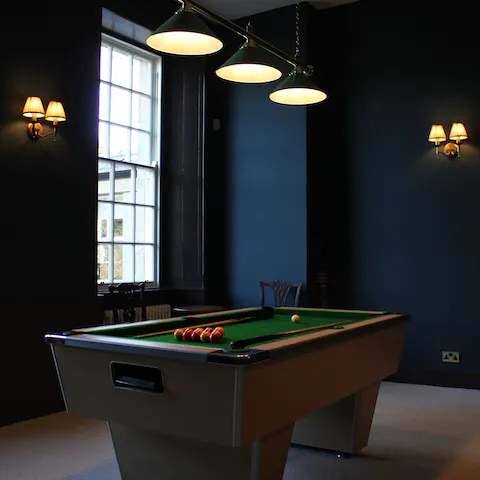 Partake in a game of pool in the evening