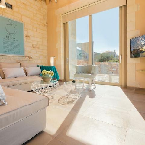 Relax in the sunny, honey-hued living room inside