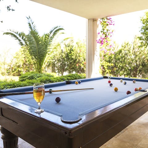 Play a game of pool on the covered terrace