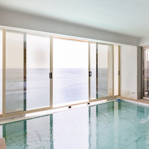 Enjoy a dip in the indoor pool while watching the sun set