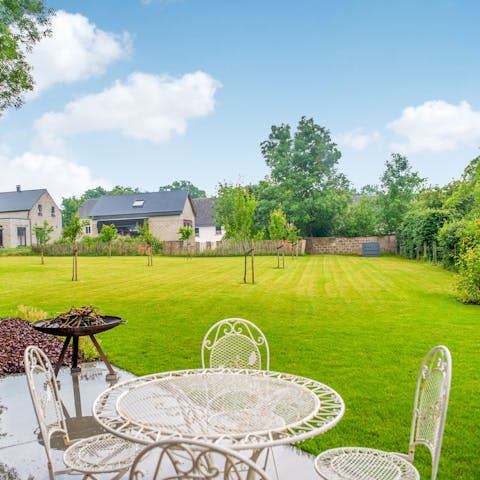 Relax on the patio with picturesque garden views