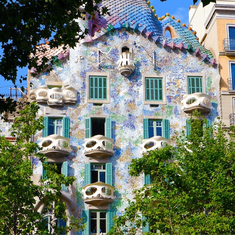 Visit the striking architecture of Casa Batlló, a thirteen-minute walk from home