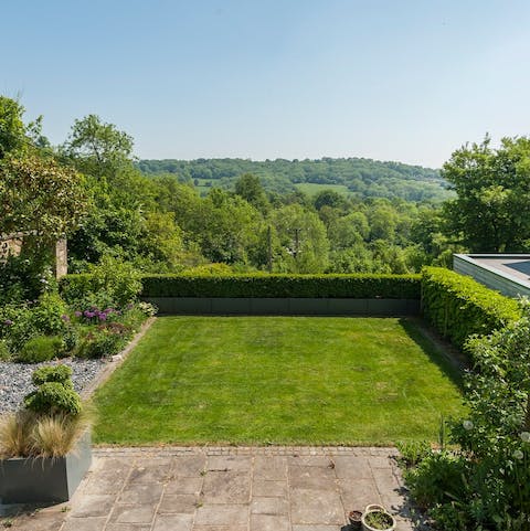 Gaze over the private garden to the rolling hills beyond