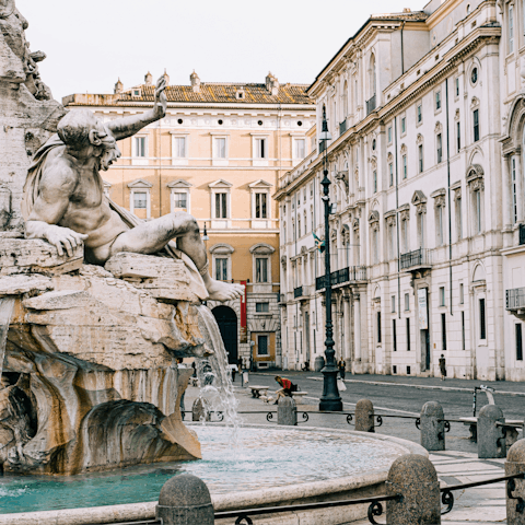 Enjoy a coffee at one of Piazza Navona's pretty cafés, a two-minute walk away