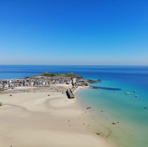Grab your sun hat and take then ten-minute walk to the pristine shores of Porthminster Beach