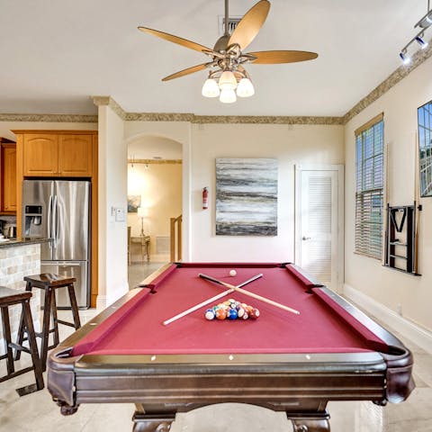 Play a round of pool at the billiards table in the kitchen