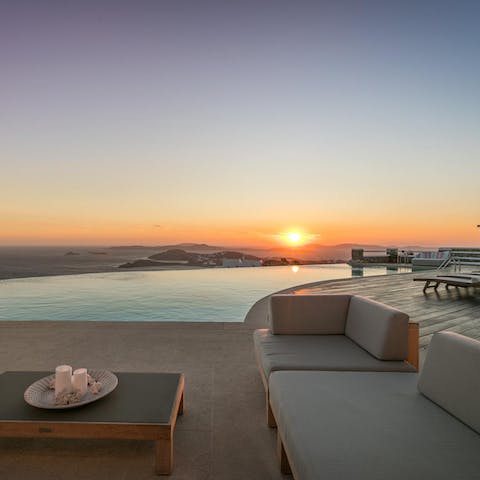 Gather on the patio to watch the sun go down over the sea