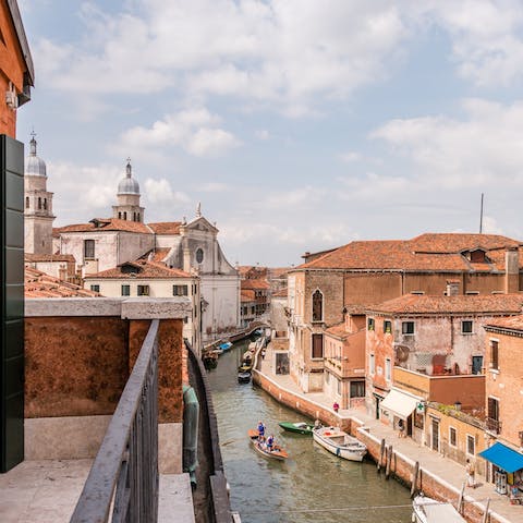 Watch the gondolas float by from the small balcony
