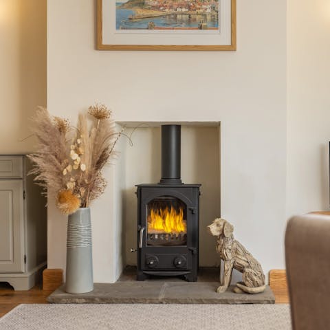Gather around the wood-burning stove for a cosy evening in