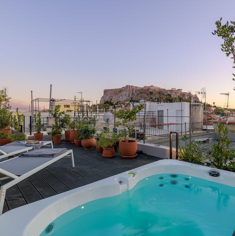 Admire the views of the Acropolis from the hot tub
