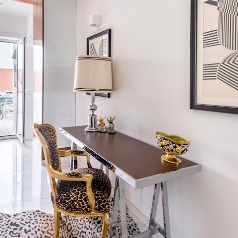 Work remotely at the dedicated laptop desk with its leopard print chair