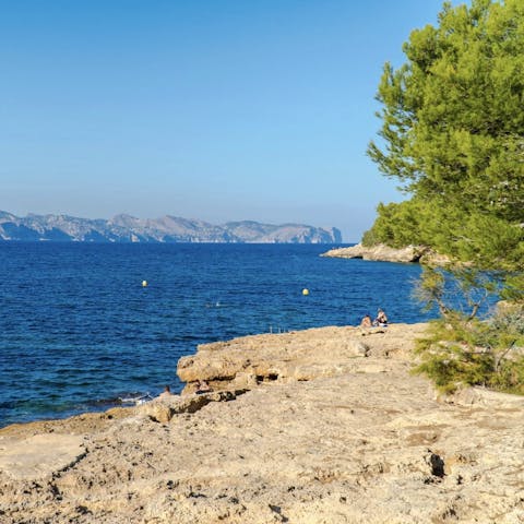 Dip your toes in the sea at the rocky beach right across the street