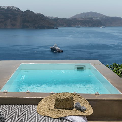 Admire the Aegean Sea from the private hot tub